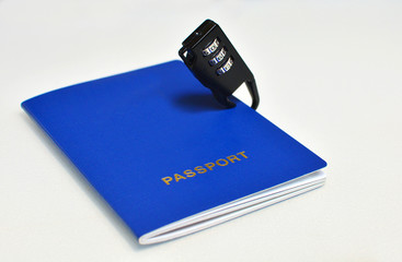 Blue passport with a black lock on a white background, close-up. No freedom concept.