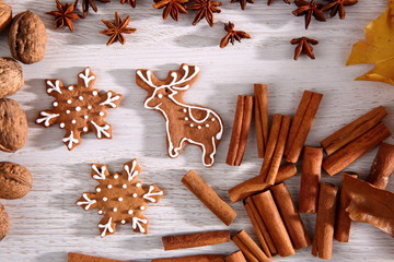 Gingerbread star poured white frosting on Christmas Eve table in a Christmas surprise for guests.
