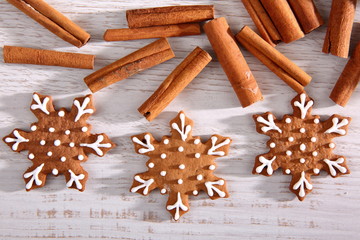 Gingerbread star poured white frosting on Christmas Eve table in a Christmas surprise for guests.
