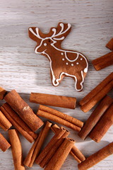 Gingerbread star poured white frosting on Christmas Eve table in a Christmas surprise for guests.

