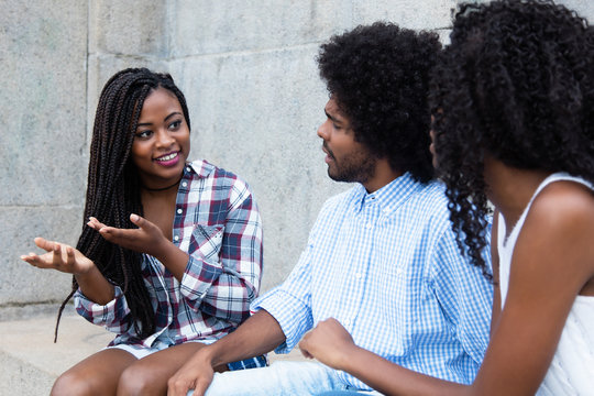 African American Woman Talking With Friends