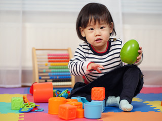 baby girl play toy at home