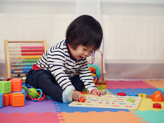 baby girl learning alphabet at home