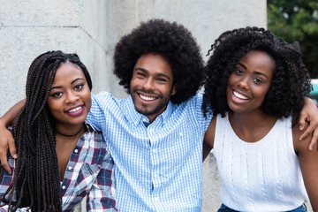 African american hipster man with two beautiful woman