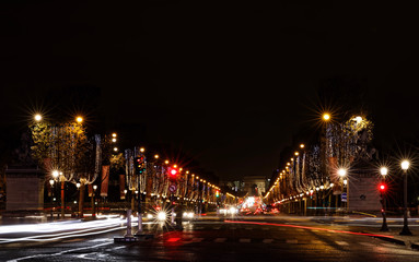 Paris, France - December 4, 2017: Avenue des Champs-Elysees with Christmas lights leading up to the Arc de Triomphe in Paris, France