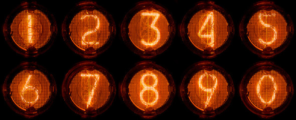 Nixie tube decimal digits. Set of real photos of very old, vintage indicator isolated on a black background.