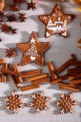Gingerbread star poured white frosting on Christmas Eve table in a Christmas surprise for guests.
