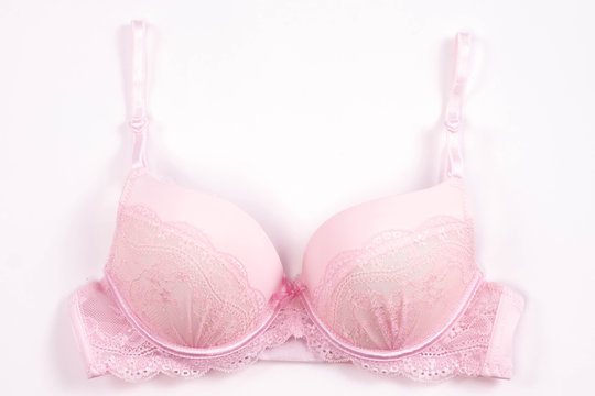 Pink bra on white background
