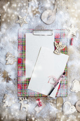 letter of Santa Claus on a wooden table, gift and Christmas decor and snow