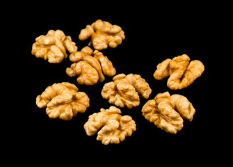 Walnuts isolated on black background