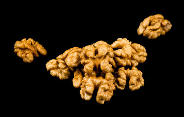 Walnuts isolated on black background