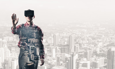 Guy wearing checked shirt and virtual mask stretching hand to to