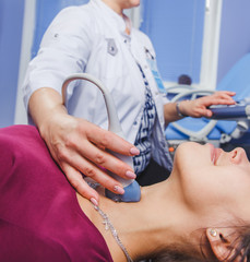 Young Woman Doing Neck Ultrasound Examination