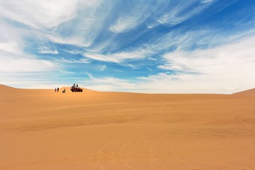 Fototapeta na wymiar Dune buggy crossing the desert in Huacachina, Ica, Peru