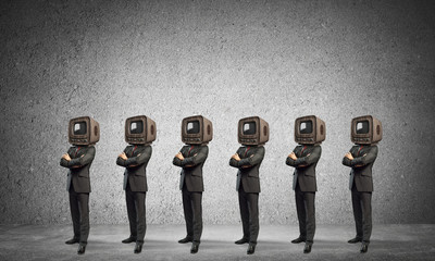 Businessmen with old TV instead of head.