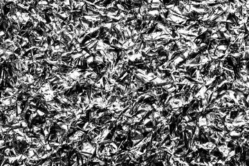 Crumpled silver kitchen foil pattern background.