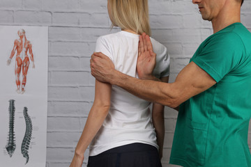 Woman having chiropractic back adjustment. Osteopathy, Physiotherapy, sport injury rehabilitation...