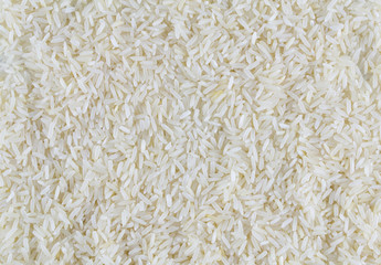 White long rice background, uncooked raw cereals, macro closeup