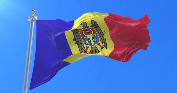 Flag of Moldova waving at wind in slow in blue sky, loop
