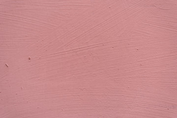 Fototapeta premium Painted pink surface with paint smears