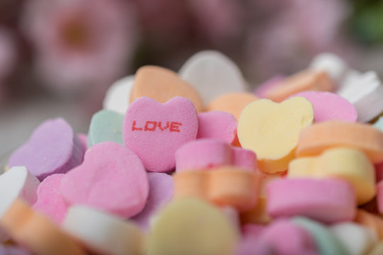 Bowl of heart  candy with focus on Love heart piece
