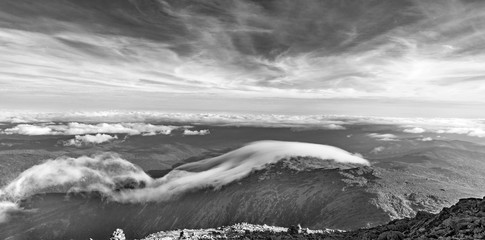 view from Mount Washington in New Hampshire to white mountains with spectacular cloudscape