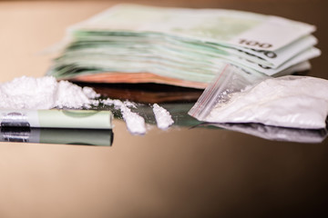euro money bank notes with white powder substance drug use 
