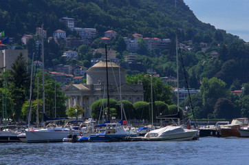 Fototapeta na wymiar sailboat moored in a small harbor of Lake Como, Italy