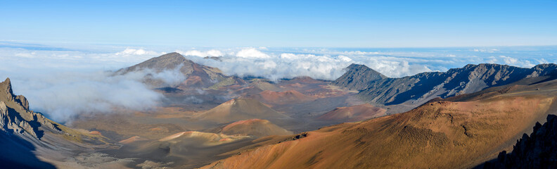 Fototapeta premium Haleakala Crater - A panoramic view of the crater at summit (10,023 feet) of Haleakala, also called East Maui Volcano, surrounded by sea of clouds. Maui, Hawaii, USA.