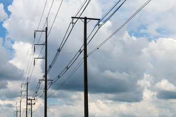 Cloudy with electric poles.