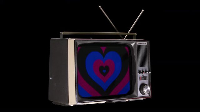 television rotating in space with a pumping heart pattenr on the screen