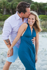 Couple has romantic embrace on the beach