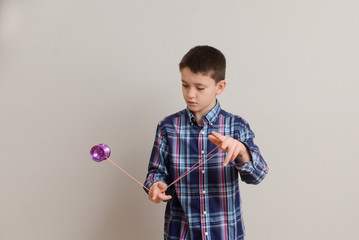 Boy performing advanced yoyo trick