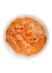 Glass of lager ale beer top view with foam