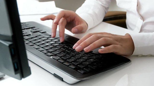 Closeup 4k footage of businesswoman hands typing on computer keyboard at office
