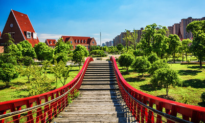 bridge in the park with city
