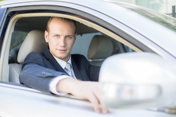 Fototapeta na wymiar Businessman driving car. Man with transportation concapt. Man Driving car to go to Office.