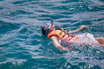 Woman snorkeling in a tropical sea