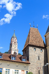 Obraz premium Gate Bozener Tor and church tower in Merano, South Tyrol