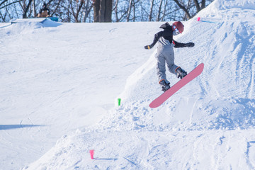 People are having fun in downhill skiing and snowboarding