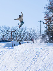 People are having fun in downhill skiing and snowboarding