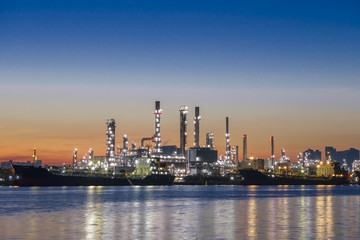 Obraz na płótnie Canvas Oil refining and Petrochemical industry. Bangkok Oil refinery along the river