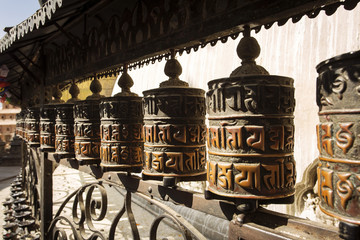 Prayer wheels made from metal at Swayambhunath Temple - Monkey Temple, Kathmandu, Nepal