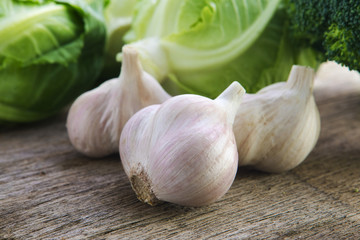 Organic vegetables, healthy food, fresh vegetables and ingredients on the table in the wood, mushrooms, garlic, etc.