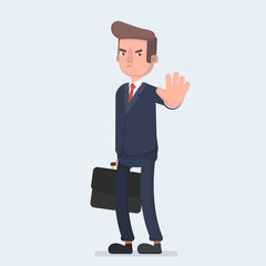 Angry business man or strict boss standing and rejecting something with stop hand gesture.