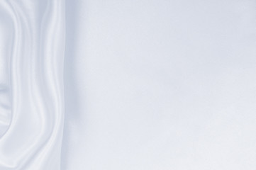 Smooth elegant grey silk or satin luxury cloth as wedding background. Luxurious Christmas background or New Year background design