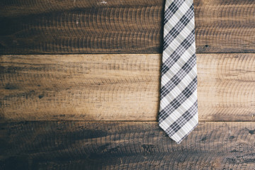 Fototapeta na wymiar tie / necktie on a wooden background. fashion concept. tie day