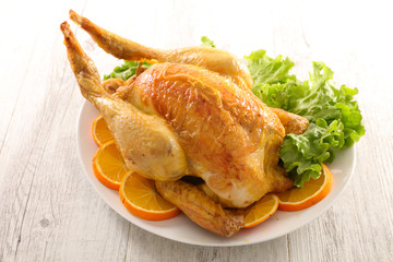 roast chicken with salad and orange