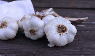Organic garlic on a wooden table in the background.Rustic style. Top view. Free space for text concept healthy lifestyle.