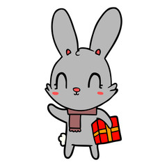 Obraz premium cute cartoon rabbit with christmas present